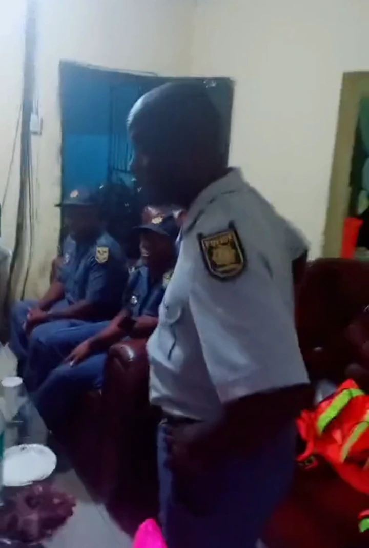 SAPS members caught on video having drinks with alleged foreigners while on duty 2